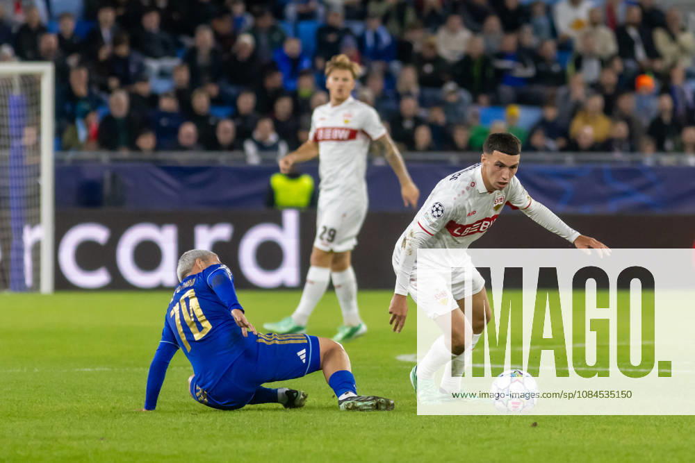 Cristian Martinez of SK Slovan Bratislava and Dženan PejÄinovic of VfB Stuttgart seen during UEFA Champions league League phase game between teams of SK Slovan Bratislava and VfB Stuttgart (Dominika Kortvelyesiova Ball Raw Images) Bratislava Tehelne Pole stadium Slovakia
