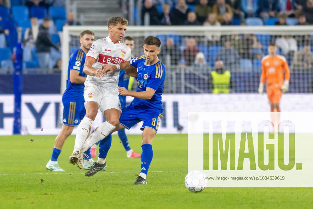 Grischa Promel of VfB Stuttgart and Artur Gajdos of SK Slovan Bratislava seen during UEFA Champions league League phase game between teams of SK Slovan Bratislava and VfB Stuttgart (Dominika Kortvelyesiova Ball Raw Images) Bratislava Tehelne Pole stadium Slovakia