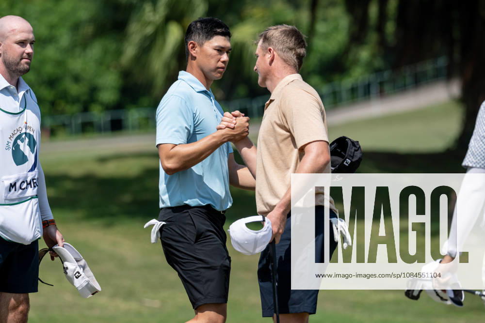Hong KongÃ¢â‚¬â ¢s Matthew CHEUNG thanks.Nick VOKE from New Zealand on the 9th green for their round.Opening Round in the Macao Open Golf at Macau Golf & Country Club. Coloane China - ZUMAr144 20261015_zap_r144_161