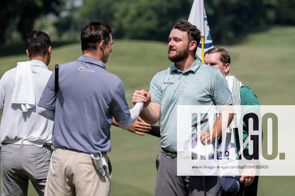 David BOOTE from Wales finishing his round on the 9th green.Shaking Australiaâ€⠢s, Will FLORIMOâ€⠢s hand (R)Opening Round in the Macao Open Golf at Macau Golf & Country Club. Coloane China - ZUMAr144 20261015_zap_r144_175