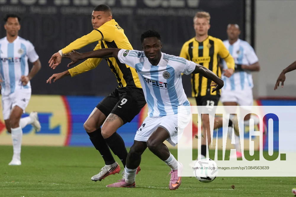 Baba Musah of Riga FC and Edmilson of Kairat compete for the ball during a UEFA Conference League soccer match between Latvias Riga FC and Kazakhstans Kairat Almaty at Skonto Stadium in Riga, Latvia, Thursday, Oct. 15, 2026. Riga Latvia