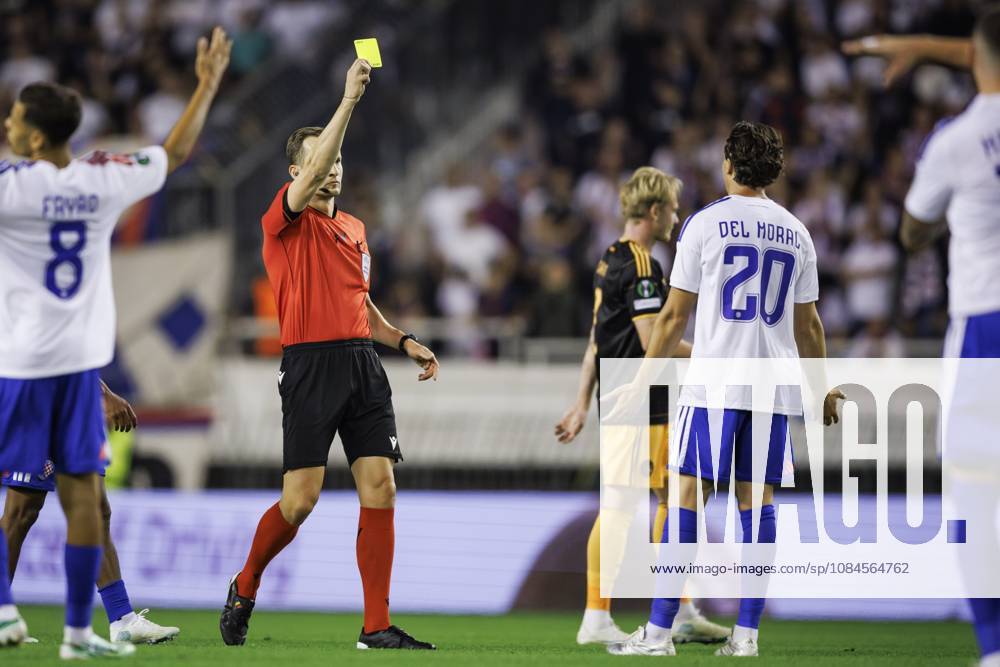 SPLIT - (lr) Referee Christian-Petru Ciochirca issues a yellow card to Alberto del Moral of Hajduk Split during the Conference League match between Hajduk Split and Ajax at Stadion Poljud on October 15, 2026 in Split, Croatia. SONNY LENSEN ANP ANPxSportx IVx 572543091 originalFilename: 572543091