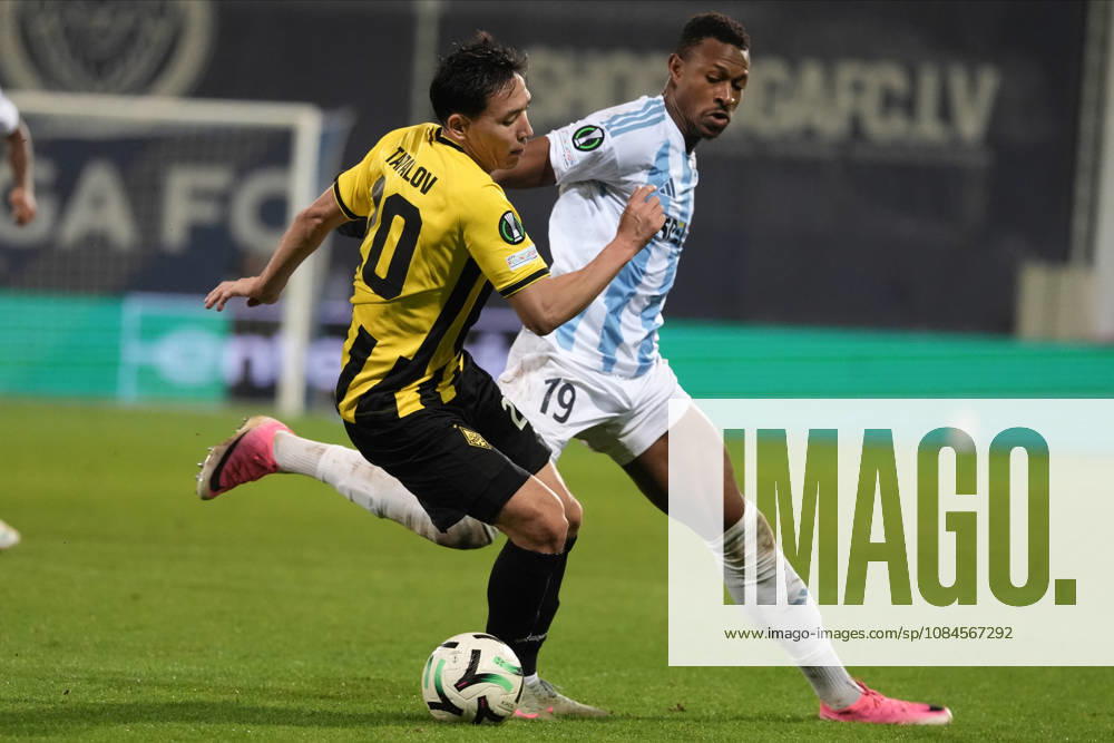 Erkin Tapalov of Kairat and Muhammed Badamosi of Riga FC compete for the ball during a UEFA Conference League soccer match between Latvias Riga FC and Kazakhstans Kairat Almaty at Skonto Stadium in Riga, Latvia, Thursday, Oct. 15, 2026. Riga Latvia