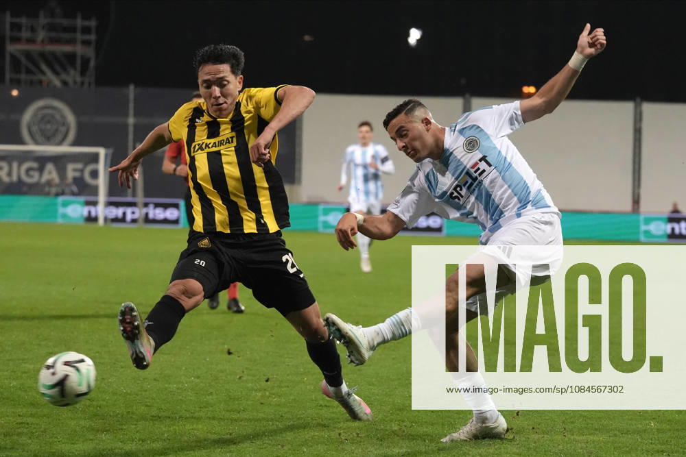 Erkin Tapalov of Kairat and Raki Aouani of Riga FC compete for the ball during a UEFA Conference League soccer match between Latvias Riga FC and Kazakhstans Kairat Almaty at Skonto Stadium in Riga, Latvia, Thursday, Oct. 15, 2026. Riga Latvia