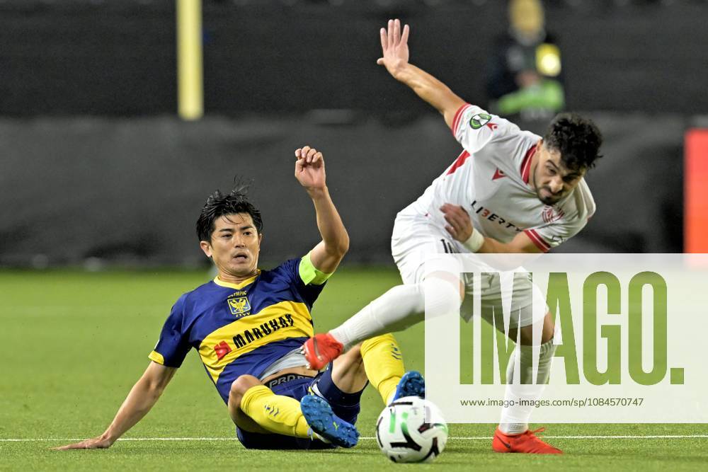 Sint-Truidense VV v Iberia Tbilisi - UEFA Conference League SINT-TRUIDEN, BELGIUM - OCTOBER 15 : Taniguchi Shogo defender of Sint-Truidense VV battles for the ball with Zviad Natchkhebia midfielder of FC Iberia 1999 Tbilisi during the UEFA Conference League 2026 27 first qualifying round between Sint-Truidense VV and Iberia Tbilisi on October 15, 2026 in Sint-Truiden, Belgium, 15 10 2026 Sint-Truiden Belgium