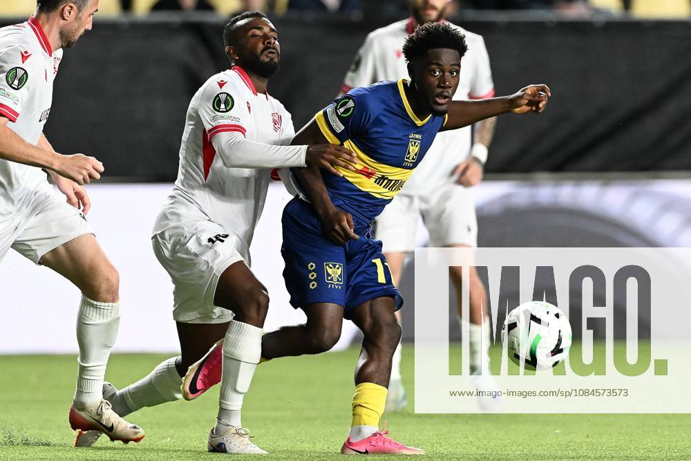 Iberia s Lucas Cafe and STVV s Nathanael Mbuku pictured in action during a soccer game between Belgian Sint-Truidense VV and Georgian FC Iberia 1999 Tbilisi, Thursday 15 October 2026 in Sint-Truiden, the opening match of the UEFA Conference League league phase. JILLxDELSAUX x189933017x