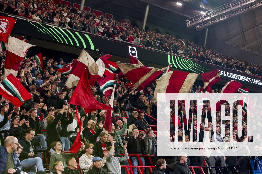ENSCHEDE - FC Twente supporters wave flags during the UEFA Conference League match between FC Twente and FC Thun at De Grolsch Veste on October 15, 2026 in Enschede, the Netherlands. WART BRINKERHOF ANP UEFA Conference League 2026 27 ANPxSportx xMarcelxterxBalsxIVx 572580893 originalFilename: 572580893