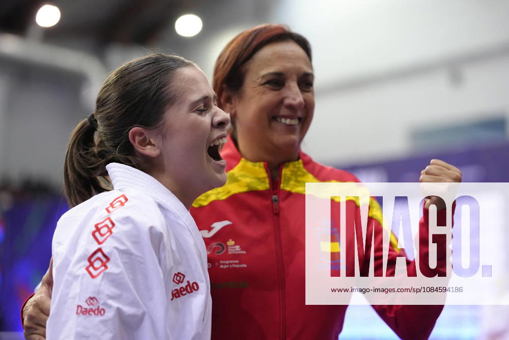 2026 World Cadet, Junior & U21, U 21 Karate Championships BIELSKO-BIALA, POLAND - OCTOBER 16: Celia Cofradas Del Castillo of Spain celebrates victory with her coach after the cadet female kumite -47kg semi-final at the 2026 World Cadet, Junior & U21 Karate Championships at Hala Pod Debowcem on October 16, 2026 in Bielsko-Biala, Poland. Bielsko-Biala Hala Pod Debowcem Poland