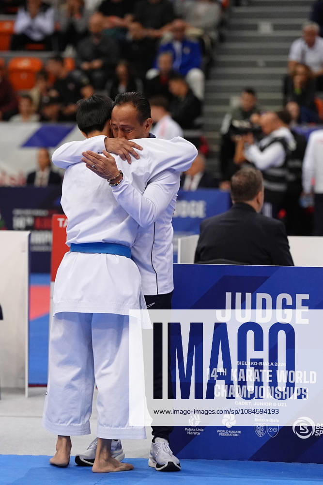2026 World Cadet, Junior & U21, U 21 Karate Championships BIELSKO-BIALA, POLAND - OCTOBER 16: Edmond Zhuo of the United States, celebrates victory with his coach John Limcaco, after winning the cadet male individual kata semi-final at the 2026 World Cadet, Junior & U21 Karate Championships at Hala Pod Debowcem on October 16, 2026 in Bielsko-Biala, Poland. Bielsko-Biala Hala Pod Debowcem Poland