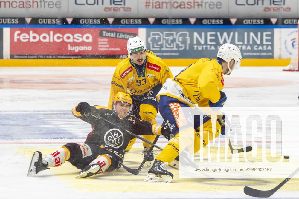 Topscorer Jere Innala of Lugano L) against Yannick Frehner of Davos C) and Filip Zadina of Davos R) during the game between HC Lugano v HC Davos at the Corner Arena on October 16, 2026 in Lugano, Switzerland. Lugano Ticino Switzerland