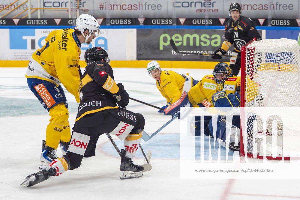 goalkeeper Sandro Aeschlimann of Davos R) saves on Ramon Tanner of Lugano 2nd L) during the game between HC Lugano v HC Davos at the Corner Arena on October 16, 2026 in Lugano, Switzerland. Lugano Ticino Switzerland