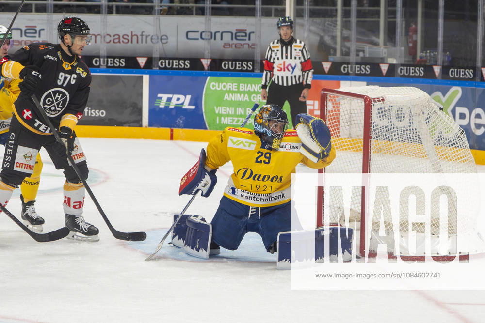 goalkeeper Sandro Aeschlimann of Davos R) cant saves on Topscorer Jere Innala of Lugano not showed) during the game between HC Lugano v HC Davos at the Corner Arena on October 16, 2026 in Lugano, Switzerland. Lugano Ticino Switzerland
