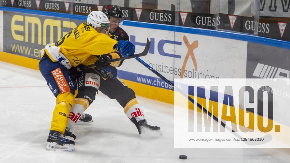 Guus Van der Kaaij of Davos L) against Olle Lycksell of Lugano R) during the game between HC Lugano v HC Davos at the Corner Arena on October 16, 2026 in Lugano, Switzerland. Lugano Ticino Switzerland