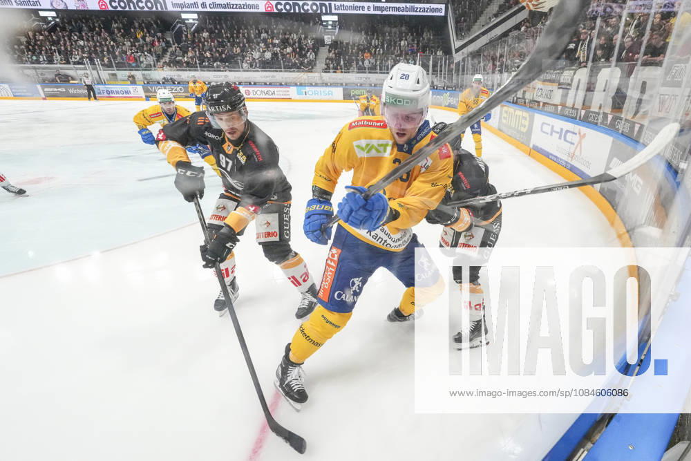 Martin Gernat of Davos C) against Calvin Thurkauf of Lugano L) and Ramon Tanner of Lugano R) during the game between HC Lugano v HC Davos at the Corner Arena on October 16, 2026 in Lugano, Switzerland. Lugano Ticino Switzerland