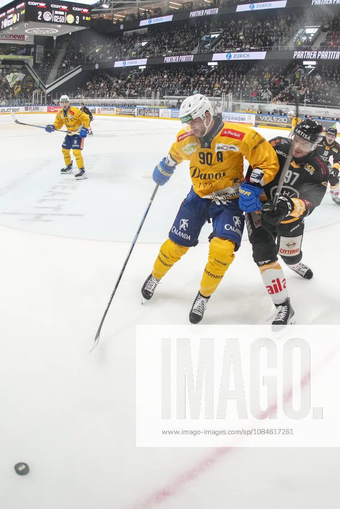 Sven Jung of Davos L) against Calvin Thurkauf of Lugano R) during the game between HC Lugano v HC Davos at the Corner Arena on October 16, 2026 in Lugano, Switzerland. Lugano Ticino Switzerland