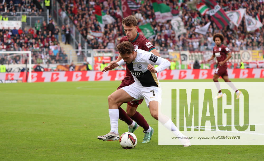 Fussball, Herren, 1. Bundesliga, Saison 2026 2027, SV 07 Elversberg - FC Augsburg, Robin Fellhauer (FC Augsburg) Maurice Krattenmacher (SV 07 Elversberg) Elversberg Ursapharm-Arena an der Kaiserlinde Saarland Deutschland