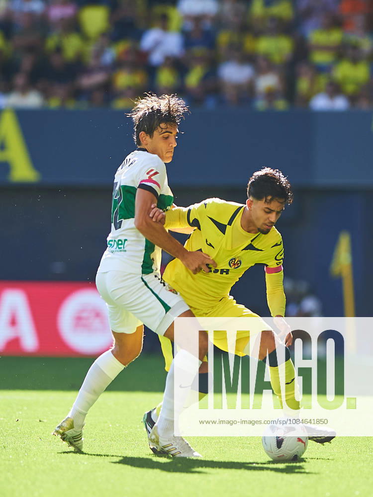 Gonzalo Villar (Elche CF) and Ilias Akhomach (Villarreal CF) during the LaLiga EA Sports match between Villarreal CF and Elche CF at Estadio de la Cerámica on October 17, 2026 in Villarreal, Spain. -