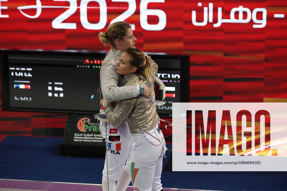 FIE Fencing World Cup in Algeria ORAN, ALGERIA - OCTOBER 18: France s Toscane Tori (L) and Bulgaria s Yoana Ilieva (R) embrace following the women s individual sabre final at the FIE Fencing World Cup at the Miloud Hadefi Olympic Complex in Oran, Algeria, on October 18, 2026. Tori defeats Ilieva 15-12 to claim her first career World Cup title. Farouk Batiche Anadolu Oran Algeria. Editorial use only. Please get in touch for any other usage.