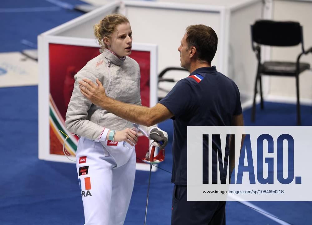 FIE Fencing World Cup in Algeria ORAN, ALGERIA - OCTOBER 18: French fencer Toscane Tori (L) speaks with a member of the French coaching staff following the women s individual sabre final at the FIE Fencing World Cup at the Miloud Hadefi Olympic Complex in Oran, Algeria, on October 18, 2026. Tori defeats Bulgaria s Yoana Ilieva 15-12 to claim her first career World Cup title. Farouk Batiche Anadolu Oran Algeria. Editorial use only. Please get in touch for any other usage.