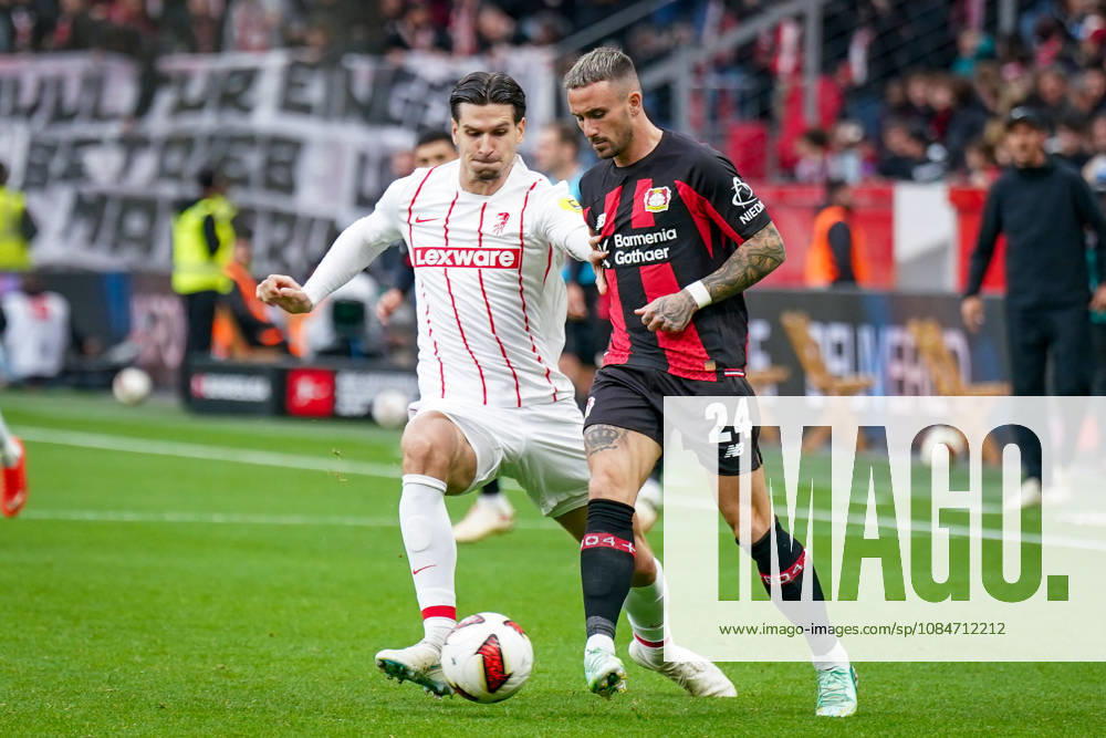 Deutschland: Fussball Bundesliga 2026 - 2027, 6. Spieltag - Bayer 04 Leverkusen vs SC Freiburg - BayArena (Leverkusen): Igor Matanovic (SC Freiburg, 31) Aleix Garcia (Bayer 04 Leverkusen, 24)