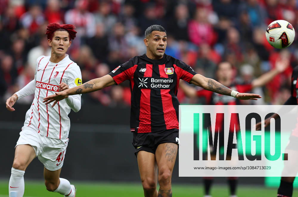 Football Bundesliga 2026 - 2027 Bayer 04 Leverkusen-SC Freiburg Goto Keisuke of Freiburg ( L ) and Medina Facundo of Leverkusen ( R ) fight for the ball during the german Bundesliga 2026 - 2027 football match between Bayer 04 Leverkusen and SC Freiburg at BayArena Stadium in Leverkusen , North Rhine-Westphalia , Germany . October 18th , 2026 Photo by Davide Elias