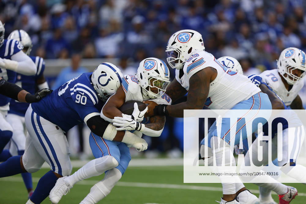 INDIANAPOLIS, IN - OCTOBER 18: Tennessee Titans running back Tony Pollard (20) is brought down by Indianapolis Colts defensive tackle Grover Stewart (90) in the first half of play during and NFL, American Football Herren, USA game between the Tennessee Titans and the Indianapolis Colts on October 18, 2026 at Lucas Oil Stadium at Indianapolis, IN. (Photo by Jeffrey Brown Icon Sportswire) NFL: OCT 18 Titans at Colts Icon101826019