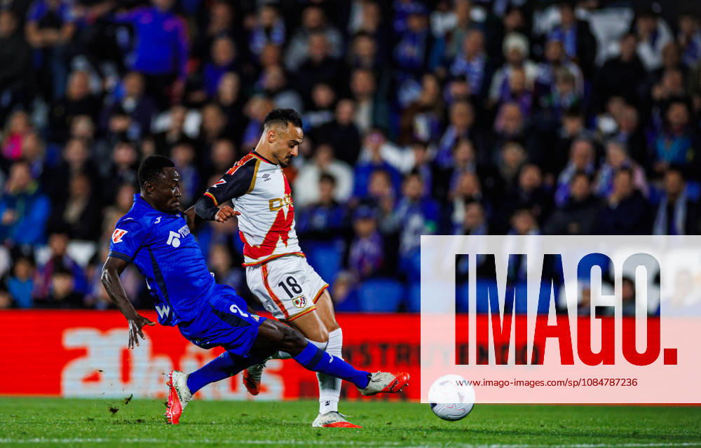 Getafe CF vs Rayo Vallecano - LaLiga EA Sports - 19 10 2026 Alvaro Garcia of Rayo Vallecano (R) battles for the ball with Dakonam Djene of Getafe CF (R) during the LaLiga EA Sports match between Getafe CF and RC Rayo Vallecano at Coliseum Stadium on October 19, 2026 in Madrid, Spain. Getafe Spain