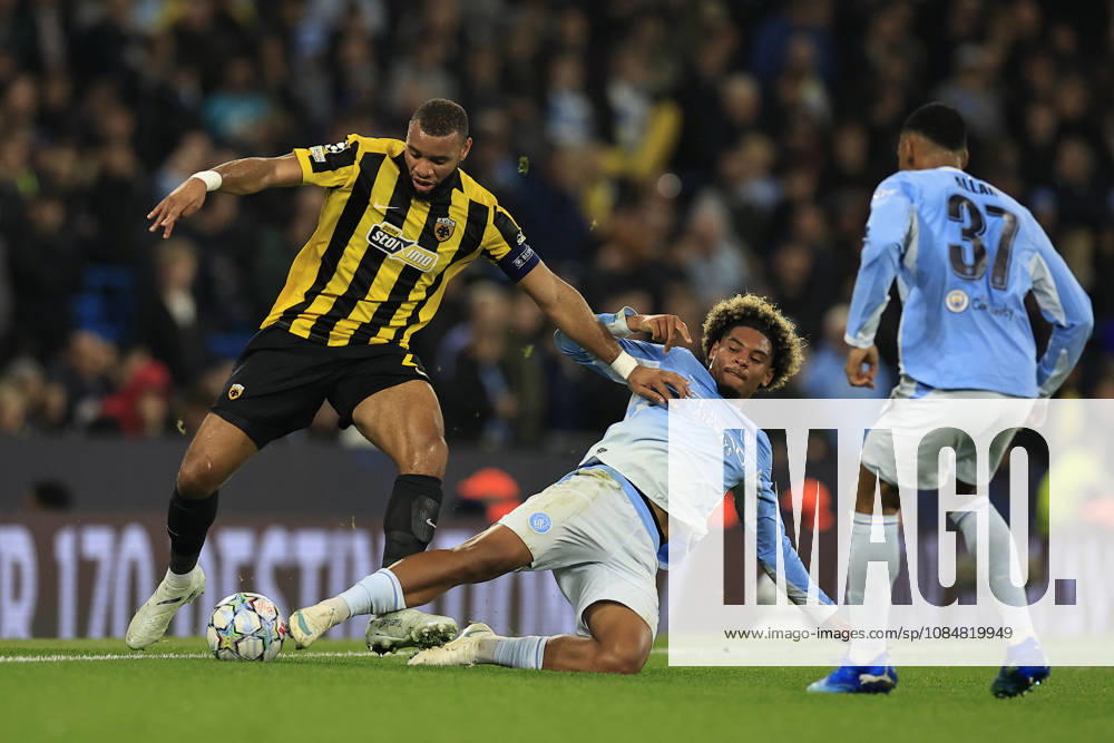 Manchester City v AEK Athens, Champions League Harold Moukoudi (2) of AEK Athens is challenged by Floyd Samba (75) of Manchester City during the Champions League match between Manchester City and AEK Athens at the Etihad Stadium, Manchester, UK on 20 October 2026. Manchester Etihad Stadium Manchester UK Editorial use only ,