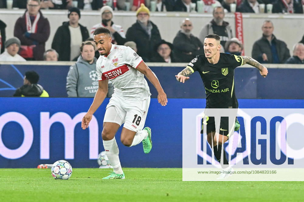 STUTTGART, GERMANY; 20. OCTOBER: tackle between Jamie LEWELING (VfB Stuttgart 18) and Alejandro GRIMALDO (Atletico Madrid 22) during the UEFA Champions League Match between VfB Stuttgart vs. Atletico Madrid at Matchday 3 at MHP Arena