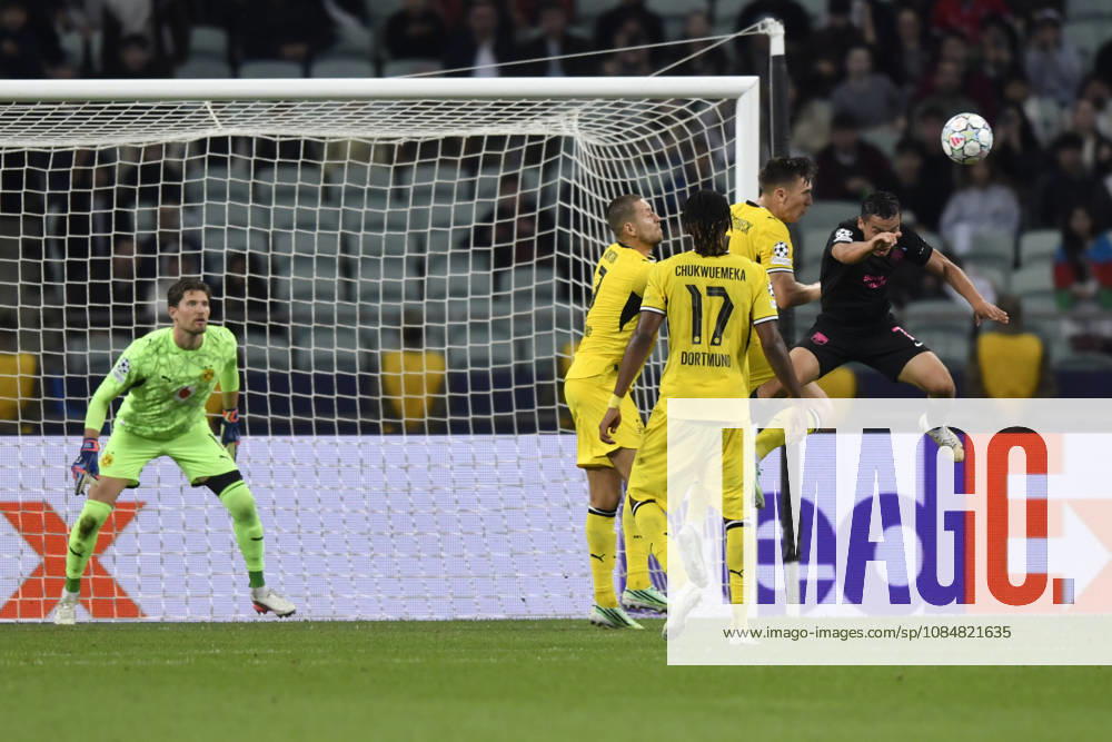 Sabah FC v Borussia Dortmund - UEFA Champions League 2026 27 League Phase MD3 BAKU, AZERBAIJAN - OCTOBER 20: Umarali Rakhmonaliev of Sabah FC heads the ball during the UEFA Champions League 2026 27 League Phase MD3 match between Sabah FC and Borussia Dortmund at Tofig Bahramov Stadium on October 20, 2026 in Baku, Azerbaijan. Baku Tofig Bahramov Stadium Azerbaijan