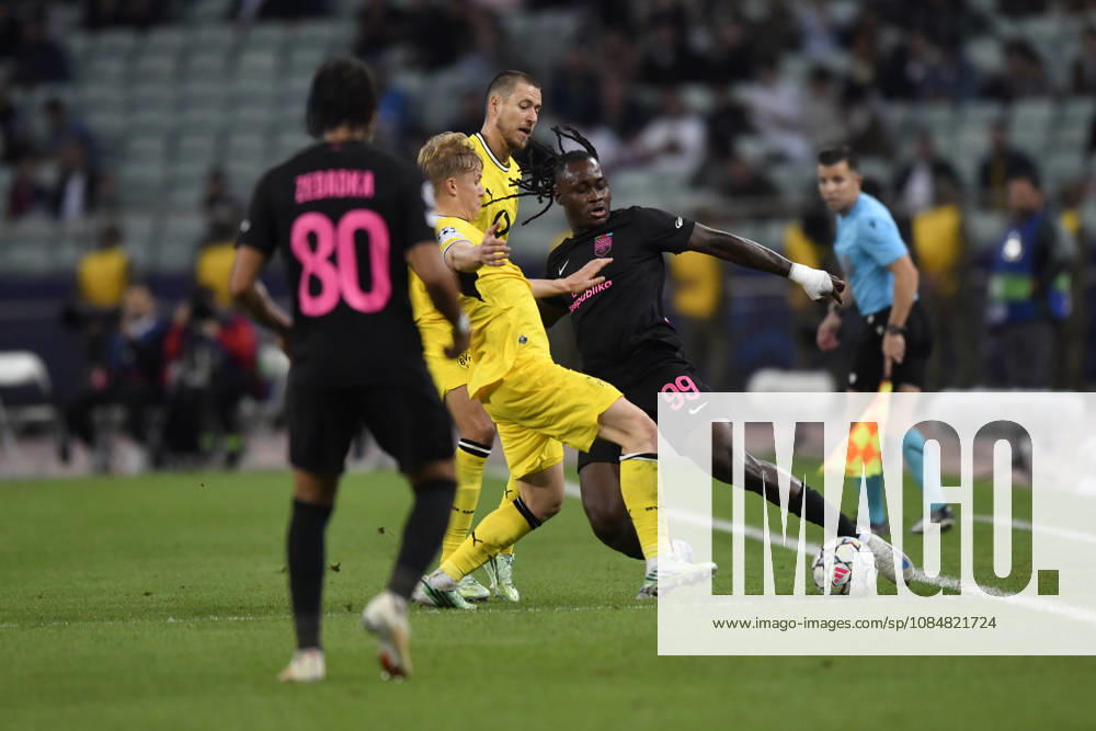 Sabah FC v Borussia Dortmund - UEFA Champions League 2026 27 League Phase MD3 BAKU, AZERBAIJAN - OCTOBER 20: Orphe Mbina of Sabah FC (R) is seen in action under pressure from Daniel Svensson of Borussia Dortmund during the UEFA Champions League 2026 27 League Phase MD3 match between Sabah FC and Borussia Dortmund at Tofig Bahramov Stadium on October 20, 2026 in Baku, Azerbaijan. Baku Tofig Bahramov Stadium Azerbaijan