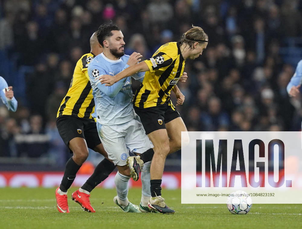 Manchester, England, 20th October 2026. Rayan Cherki of Manchester City tackled by Lovro Majer of AEK Athens (r) during the Manchester City vs AEK Athens UEFA Champions League match at the Etihad Stadium, Manchester. Picture credit should read: Andrew Yates Sportimage . SPI_046_AY_ManCity__Athens SPI-5090-0046