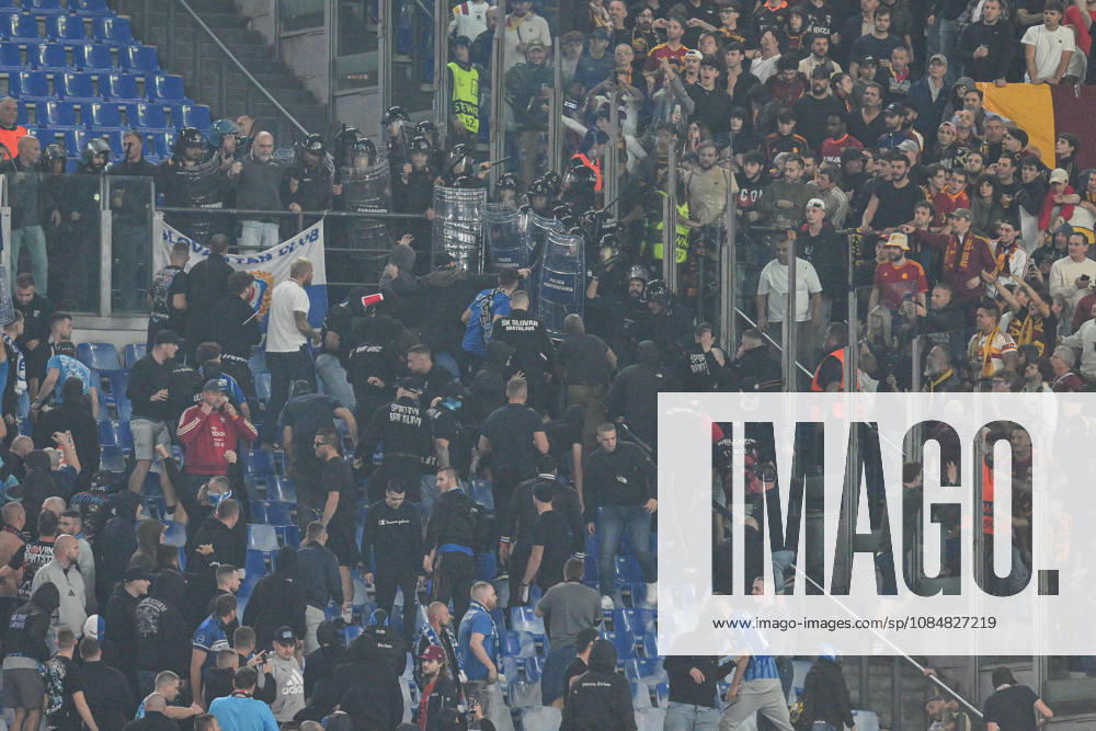 IPA89965270 - Clashes between fans in the stands during the UEFA Champions League soccer match between Roma and Slovan Bratislava at the Olimpico Stadium on October 20, 2026, in Rome, Lazio. During the AS Roma vs. Slovan Bratislava UEFA Champions League soccer match in Rome, Italy, on October 20, 2026