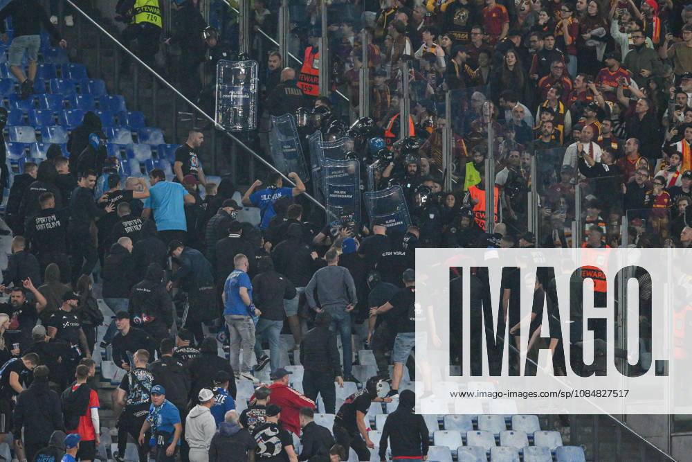 IPA89965290 - Clashes between fans in the stands during the UEFA Champions League soccer match between Roma and Slovan Bratislava at the Olimpico Stadium on October 20, 2026, in Rome, Lazio. During the AS Roma vs. Slovan Bratislava UEFA Champions League soccer match in Rome, Italy, on October 20, 2026
