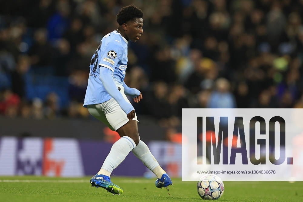 Manchester City v AEK Athens, Champions League Ryan McAidoo (56) of Manchester City passes the ball during the Champions League match between Manchester City and AEK Athens at the Etihad Stadium, Manchester, UK on 20 October 2026. Manchester Etihad Stadium Manchester UK Editorial use only ,