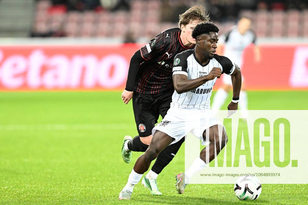 Midtjylland s Sofus Johannesen and STVV s Nathanael Mbuku pictured in action during a soccer game between Danish FC Midtjylland and Belgian Sint-Truidense VV, Thursday 22 October 2026 in Herning, Denmark, on the second day of the UEFA Conference League league phase. JILLxDELSAUX x190690542x