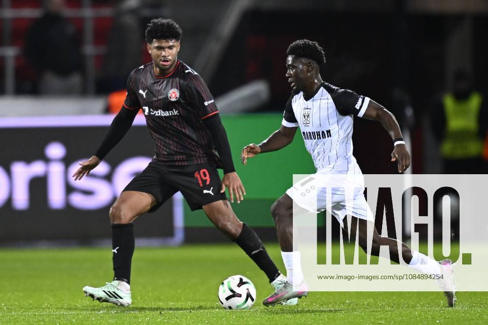 FC Midtjylland v Sint-Truidense VV - UEFA Conference League HERNING, DENMARK - OCTOBER 22 : Bravo Pedro midfielder of Midtjylland and Mbuku Nathanael forward of Sint-Truidense VV during the UEFA Conference League 2026 27 League Phase matchday 2 match between FC Midtjylland and Sint-Truidense VV on October 22, 2026 in Herning, Denmark, 22 10 2026 Herning Denmark