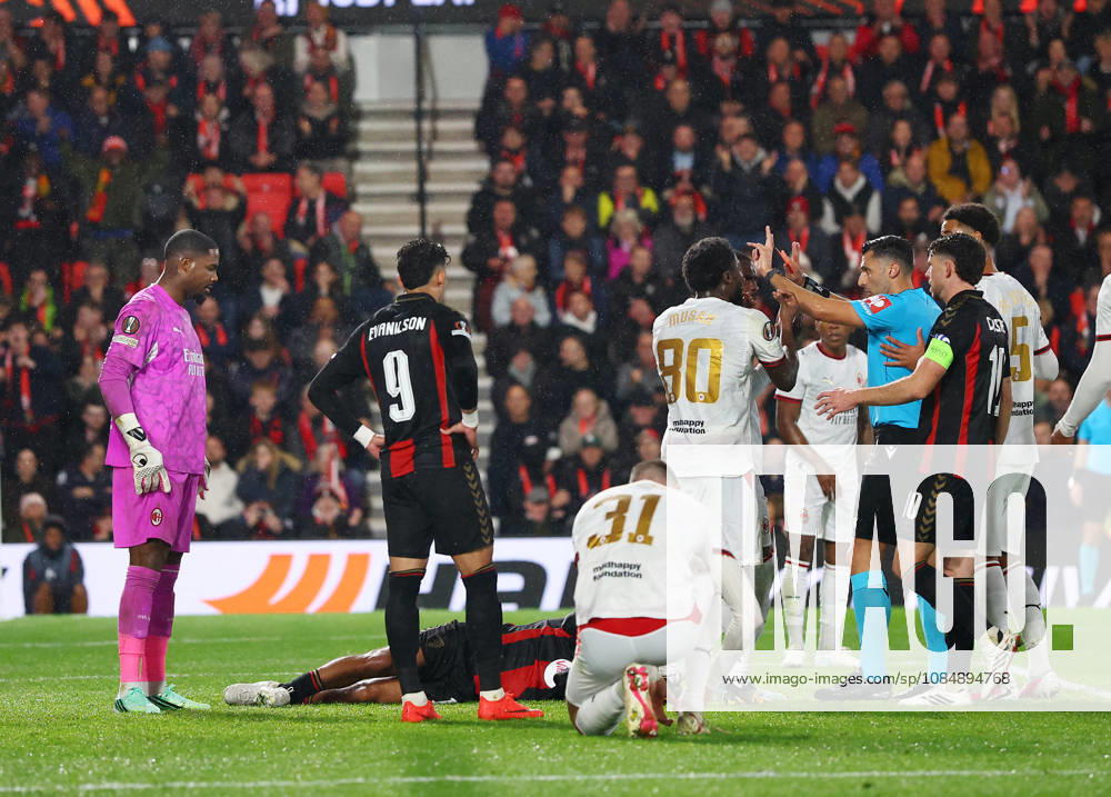 Bournemouth, England, 22nd October 2026. Referee Vassilis Fotias brandishes a red card to Mike Maignan of AC Milan after he pushed Tyler Adams of Bournemouth in the face during the AFC Bournemouth vs AC Milan UEFA Europa League match at the Vitality Stadium, Bournemouth. Picture credit should read: Paul Terry Sportimage . SPI_039_PT_Bournmouthmouth_AC_Milan SPI-5092-0039