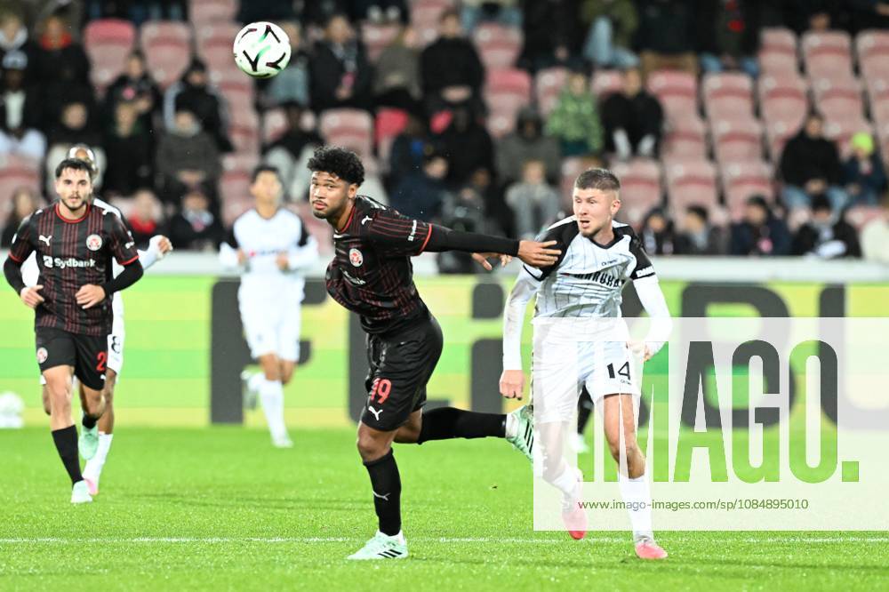 Midtjylland s Pedro Bravo and STVV s Ryan Merlen pictured in action during a soccer game between Danish FC Midtjylland and Belgian Sint-Truidense VV, Thursday 22 October 2026 in Herning, Denmark, on the second day of the UEFA Conference League league phase. JILLxDELSAUX x190692047x