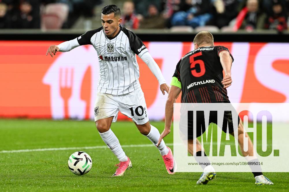 STVV s Ilias Sebaoui and Midtjylland s Rasmus Kristensen pictured in action during a soccer game between Danish FC Midtjylland and Belgian Sint-Truidense VV, Thursday 22 October 2026 in Herning, Denmark, on the second day of the UEFA Conference League league phase. JILLxDELSAUX x190692109x