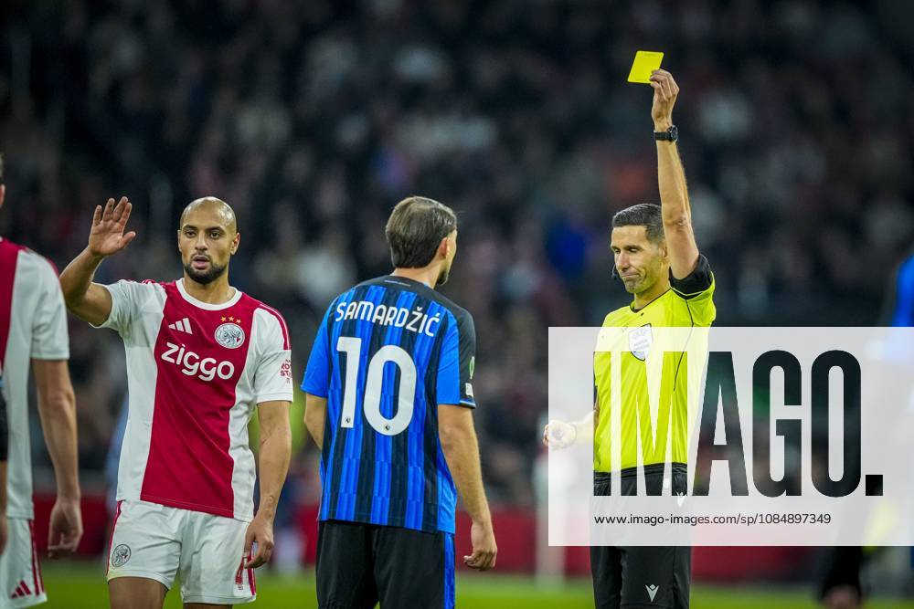 , JohanCruijff ArenA , season 2026 2027 , UEFA Conference League , League phase - Matchday 3 football , match between Ajax and Atalanta , Picture shows Atalanta player Lazar Vujadin Samardzic get a yellow card from referee Antonio Nobre Ajax - Atalanta x208964069x