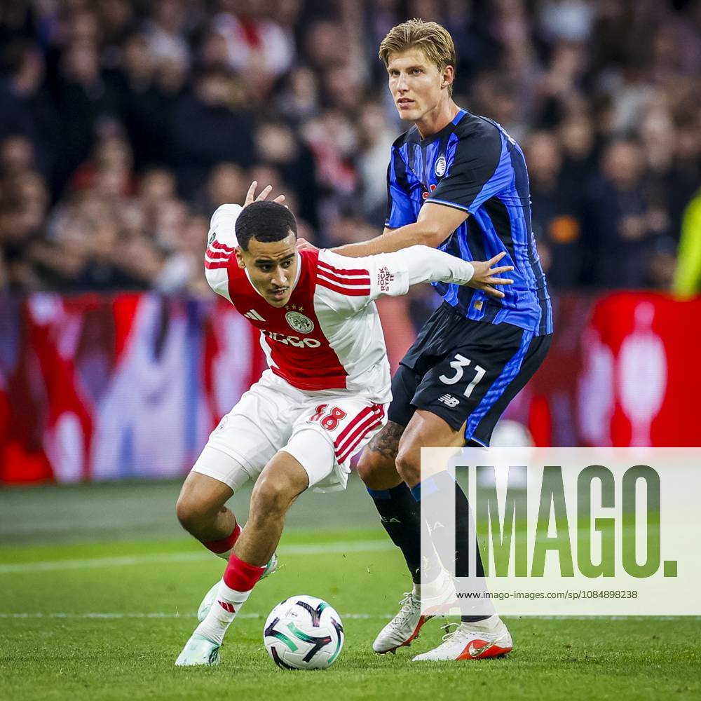 , JohanCruijff ArenA , season 2026 2027 , UEFA Conference League , League phase - Matchday 3 football , match between Ajax and Atalanta , Picture shows Ajax player Abdellah Ouazane and Atalanta player Thomas Kristensen Ajax - Atalanta x208964795x