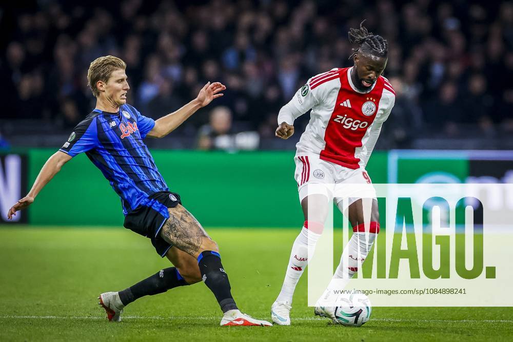 , JohanCruijff ArenA , season 2026 2027 , UEFA Conference League , League phase - Matchday 3 football , match between Ajax and Atalanta , Picture shows Atalanta player Thomas Kristensen and Ajax player Toluwalase Arokodare Ajax - Atalanta x208964797x