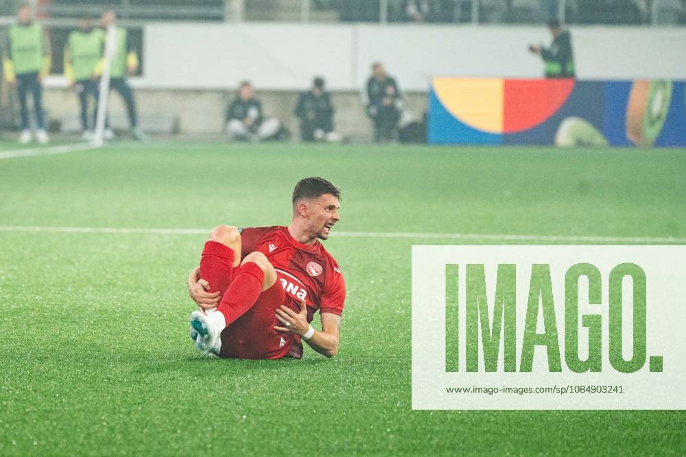 THUN, BERN - OCTOBER 22: Fabio Fehr of FC Thun falls to the ground during the UEFA Conference League match between FC Thun and HNK Hajduk Split at VISANA STADION on October 22, 2026 in Thun, Bern, Switzerland.