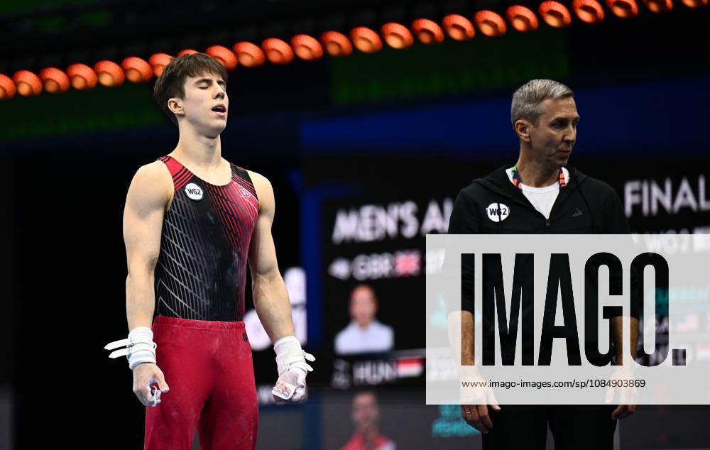 Netherlands Artistic Gymnastics World Championships 9271035 22.10.2026 Arsenii Dukhno of Team World Gymnastics Neutral Athletes 2 prepares to compete on the horizontal bar as his father and coach, Andrei Dukhno, stands nearby during the men s all-around final at the 2026 World Artistic Gymnastics Championships in Rotterdam, the Netherlands. Alexey Filippov Sputnik Rotterdam Netherlands