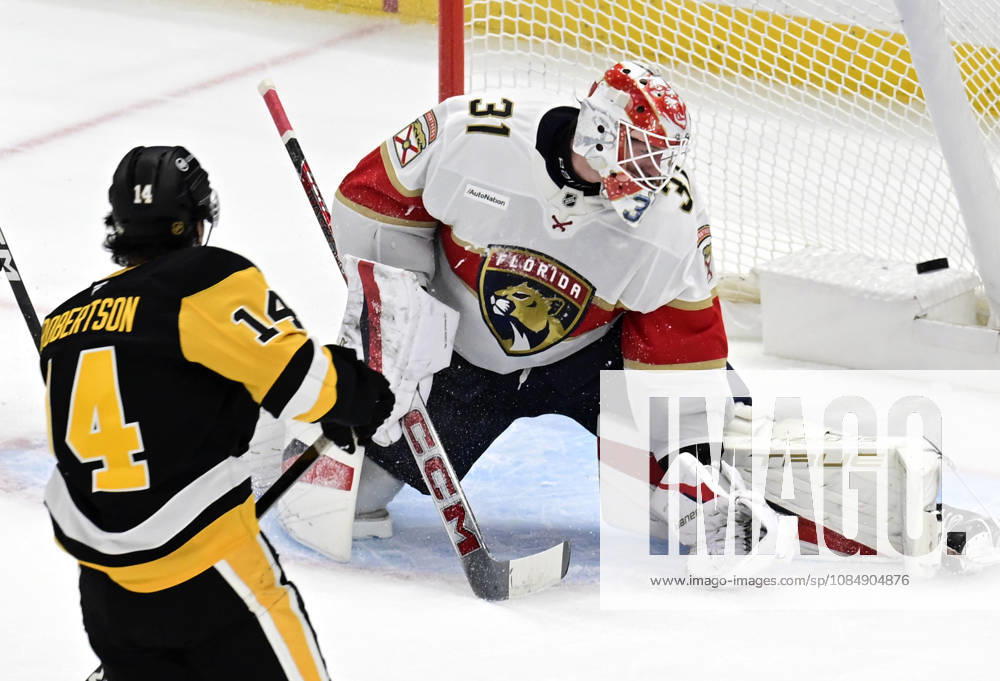 Pittsburgh Penguins left wing Nick Robertson (14) scores on Florida Panthers goalie Cooper Black (31) in the first period at PPG Paints Arena in Pittsburgh on Thursday, October 22, 2026. PIT2026102201 ARCHIExCARPENTER