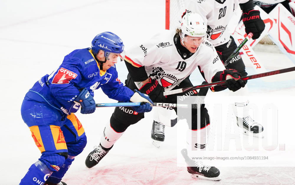 Zug Schweiz. Eishockey Herren Saison 2026-2027 EV Zug - HC Lausanne. Bild. Andreas Wingerli EV Zug gegen 19 Taylor Raymond Fust Lausanne HC Aktion Einuelbild