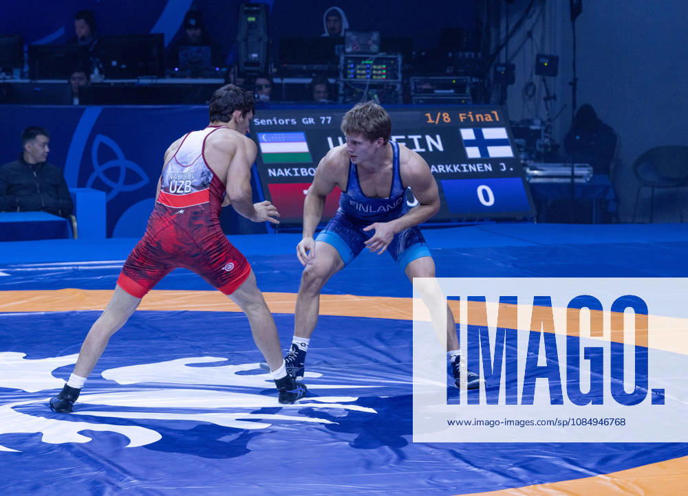 Astana, 2021 World Wrestling Championshi, Kazakhstan: Uzbekistan s Doniyorkhon Nakibov red competes against Finland s Jonni Kunnari Sarkkinen blue in the men s Greco-Roman 77kg competition at the Senior World Wrestling Championships in Astana, Kazakhstan, on October 24, 2026. Nakibov won the bout 7-2. . Astana Kazakhstan - ZUMAt172 20261024_zip_t172_001