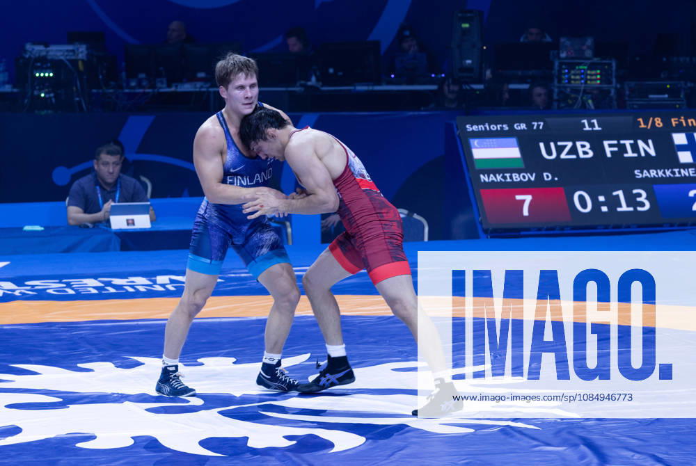 Astana, 2021 World Wrestling Championshi, Kazakhstan: Uzbekistan s Doniyorkhon Nakibov red competes against Finland s Jonni Kunnari Sarkkinen blue in the men s Greco-Roman 77kg competition at the Senior World Wrestling Championships in Astana, Kazakhstan, on October 24, 2026. Nakibov won the bout 7-2. . Astana Kazakhstan - ZUMAt172 20261024_zip_t172_003