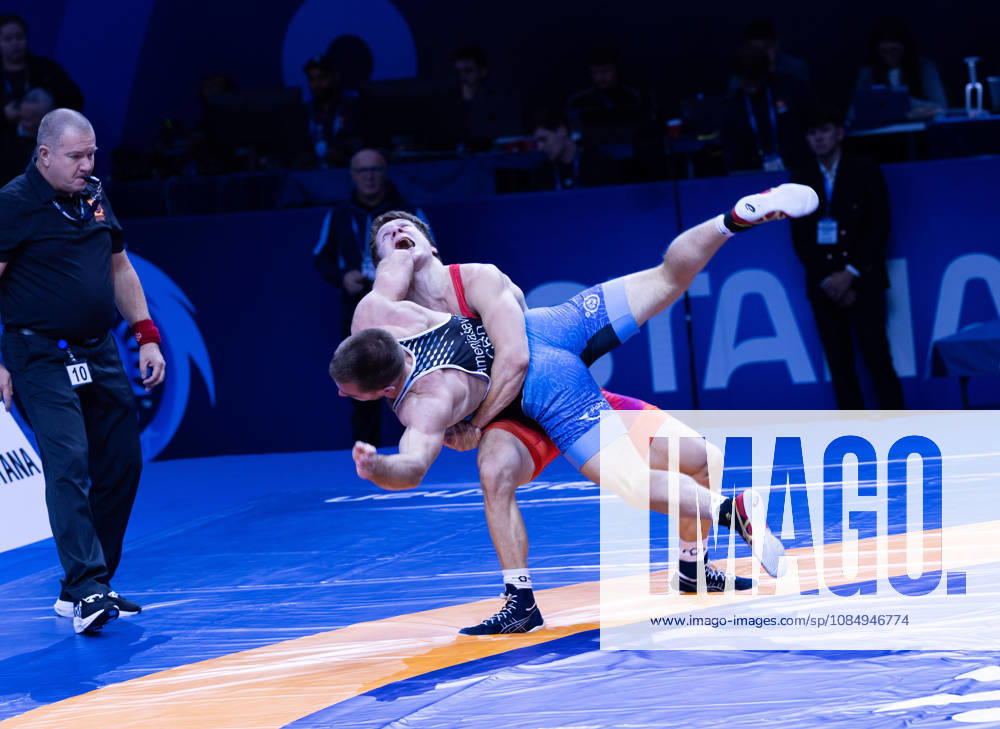 Astana, 2021 World Wrestling Championshi, Kazakhstan: Finland s Jonni Kunnari Sarkkinen red competes against Croatia s Antonio Kamenjasevic blue in the men s Greco-Roman 77kg competition at the Senior World Wrestling Championships in Astana, Kazakhstan, on October 24, 2026. Sarkkinen won the bout 7-2. . Astana Kazakhstan - ZUMAt172 20261024_zip_t172_004